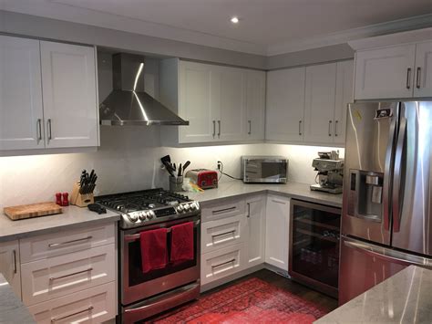 kitchen with white cabinets and easy care stainless steel refrigerator|white kitchens with stainless steel cabinets.